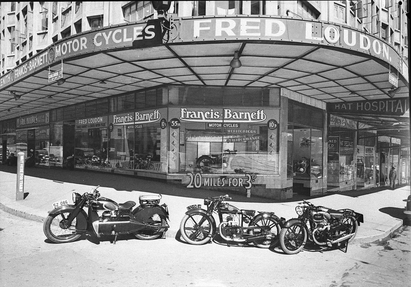 Fred Loudon's motorcycle shop on a Sydney street corner in 1938, its name wrapped around the awning