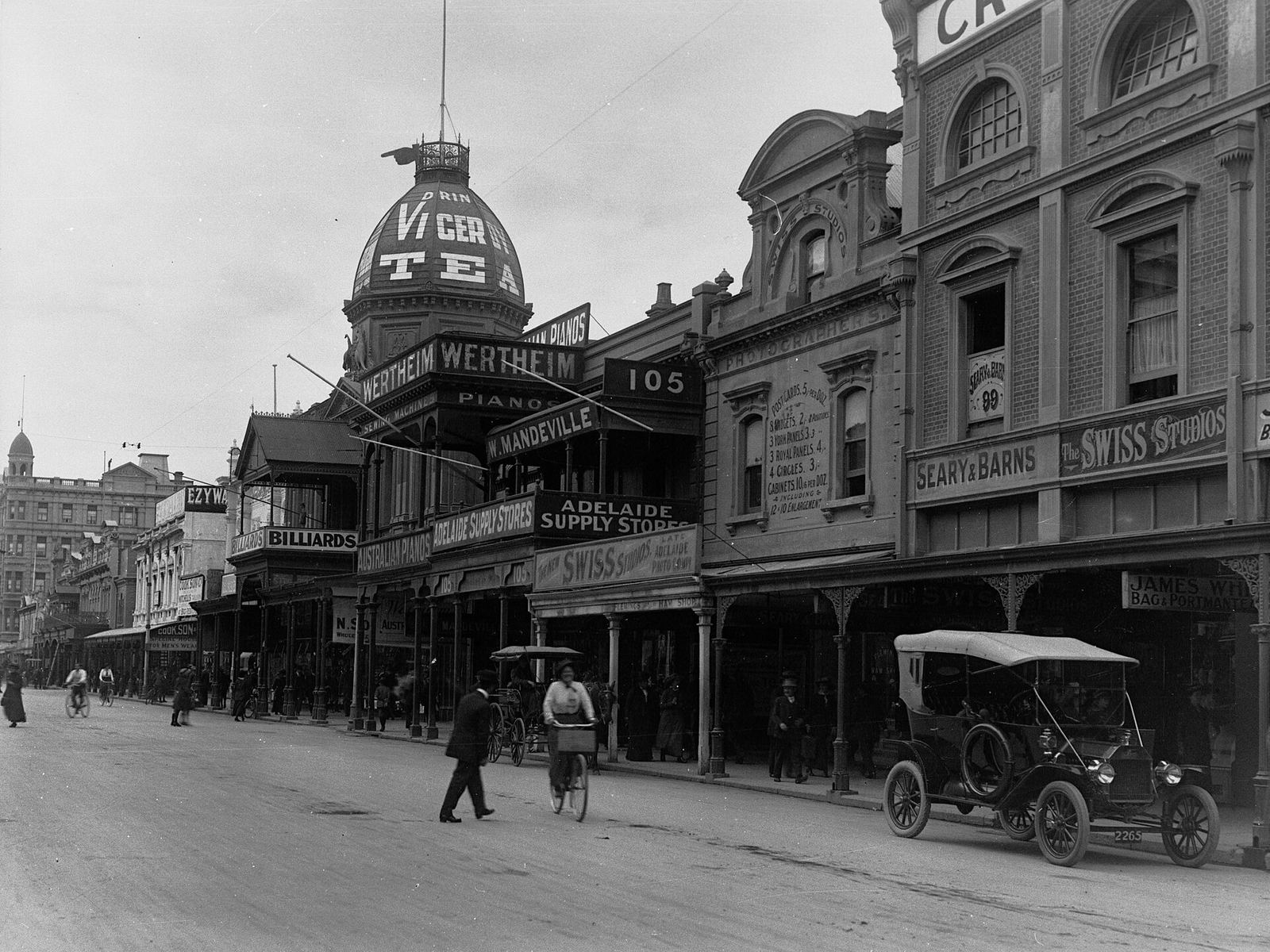 Rundle Street, Adelaide, in 1916, its verandahs crowded with shop signs